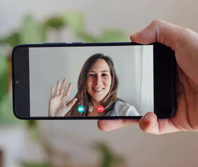 woman on a phone screen video call